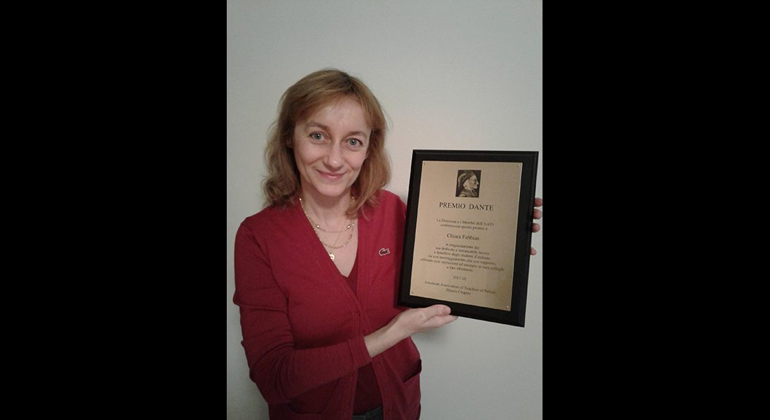 Chiara Fabbian poses with her Dante Award plaque
